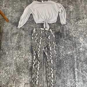 tan long sleeve top with snake skin jeans